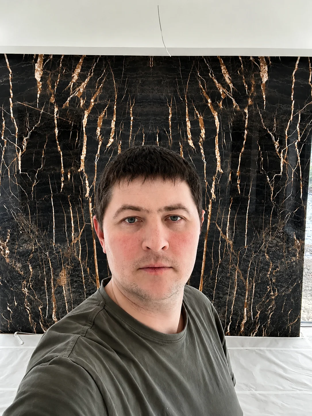 Alexander Marchuk, tile installer, on site